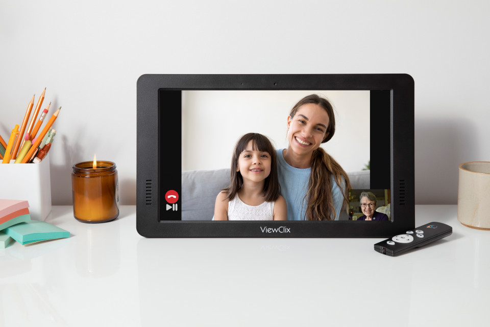 A ViewClix frame bringing a family video call into the room