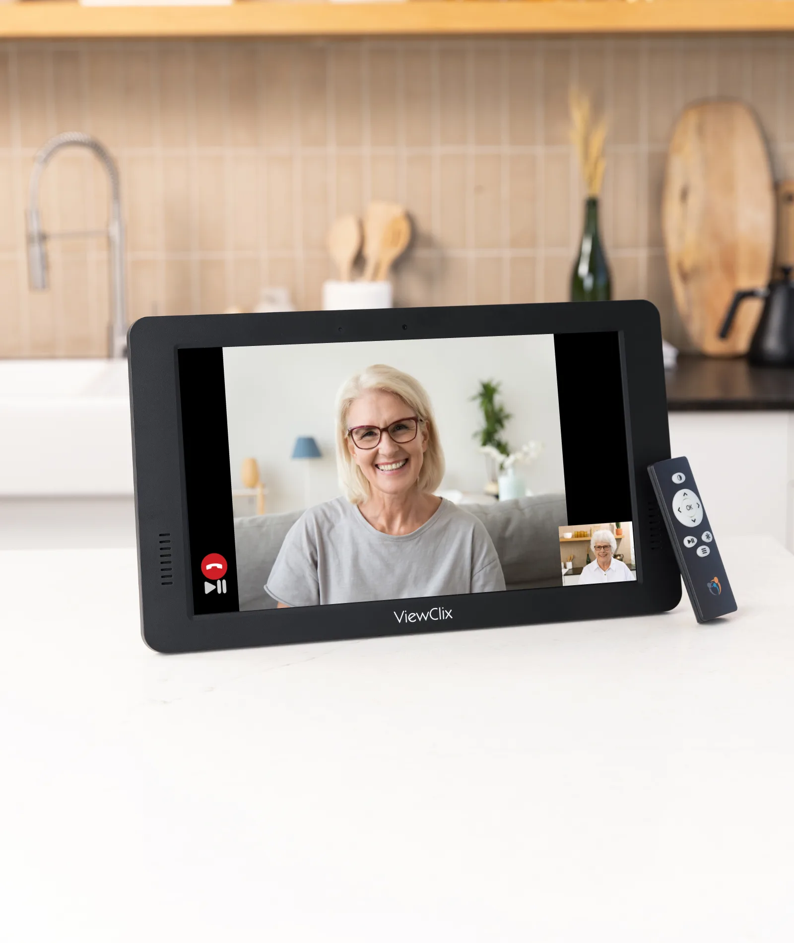 A ViewClix frame showing a video call on a kitchen counter